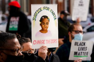 FILE - Protesters call for police accountability in the death of 8-year-old Fanta Bility who was shot outside a football game, at the Delaware County Courthouse in Media, Pa., Thursday, Jan. 13, 2022.