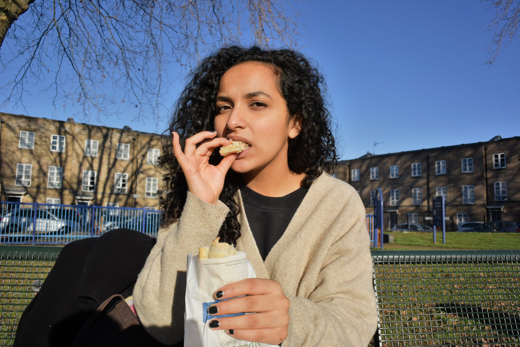 Carla Abreu eating a Greggs vegan sausage roll