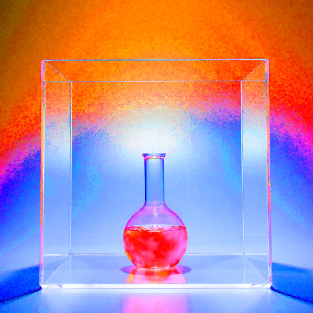 Beaker filled with glowing pink liquid, surrounded by blue light.