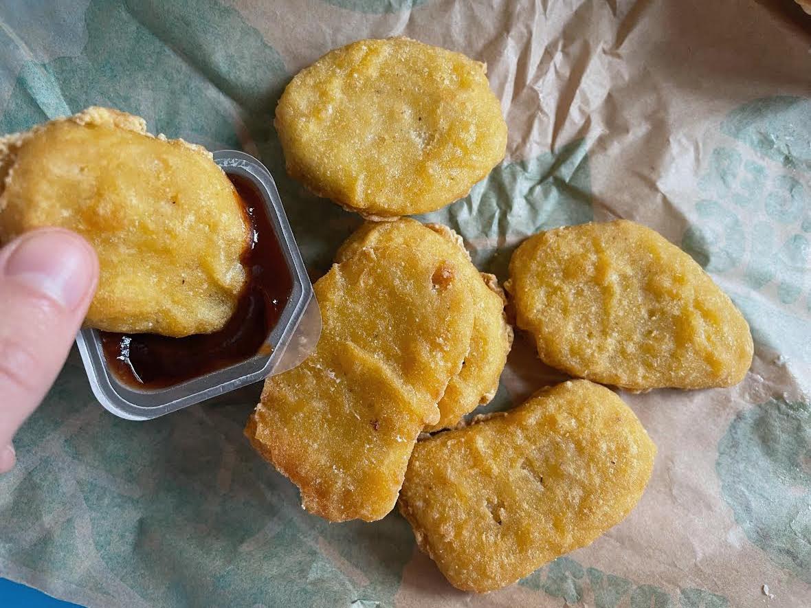 The Burger King vegan nuggets dipped into sauce