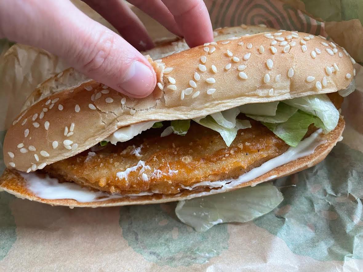 A hand holding the Burger King Vegan Royale