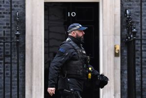 A police officer walks past Downing Street. Photo: Daniel LEAL / AFP