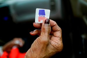 Sadie Janes shows off her voting sticker after casting her ballot at Floyd Middle Magnet School during the Democratic presidential primary in Montgomery, Alabama, March 3, 2020. (JOSHUA LOTT/AFP via Getty Images)