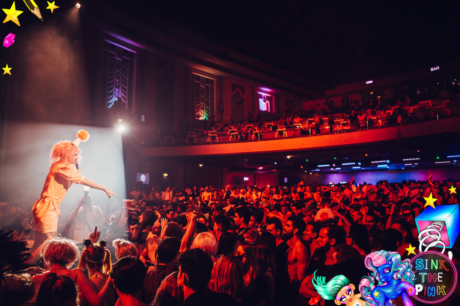 A Sink the Pink drag queen performing at the Troxy to a crowd