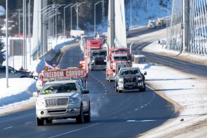 Protesters and supporters drive over the Nipigon Bridge on the Trans Canada Highway as part of a trucking convoy against COVID-19 vaccine mandates in Nipigon, Ont., on Thursday, Jan. 27, 2022.