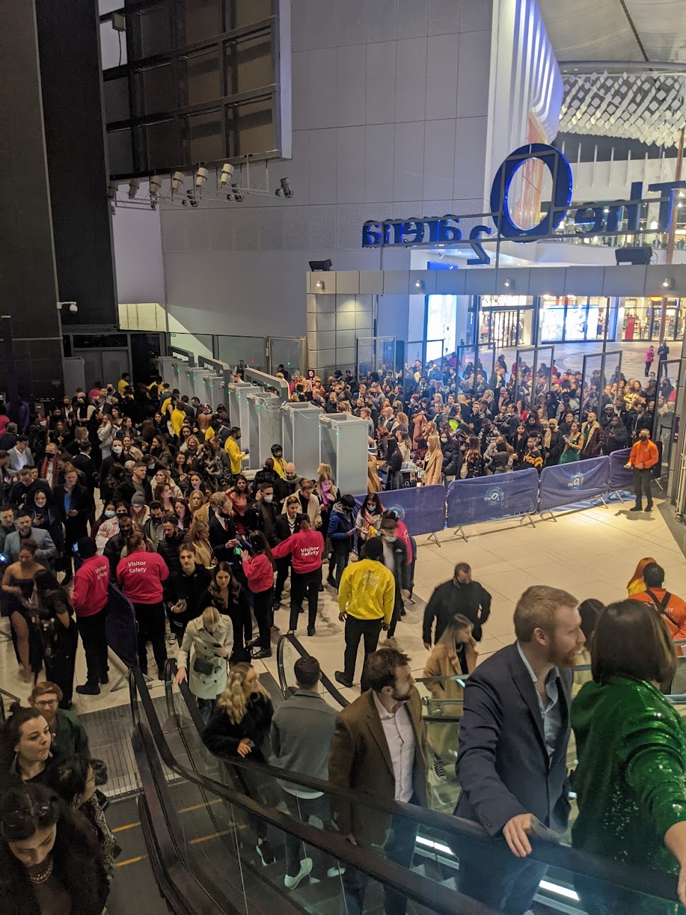 Brit Award 2022 guests in the queue on escalators at the O2