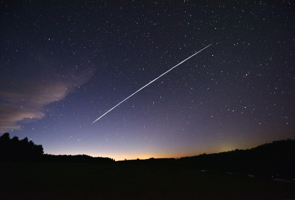 A long-exposure image shows a trail of a group of SpaceX's Starlink satellites passing over Uruguay. Getty Images​