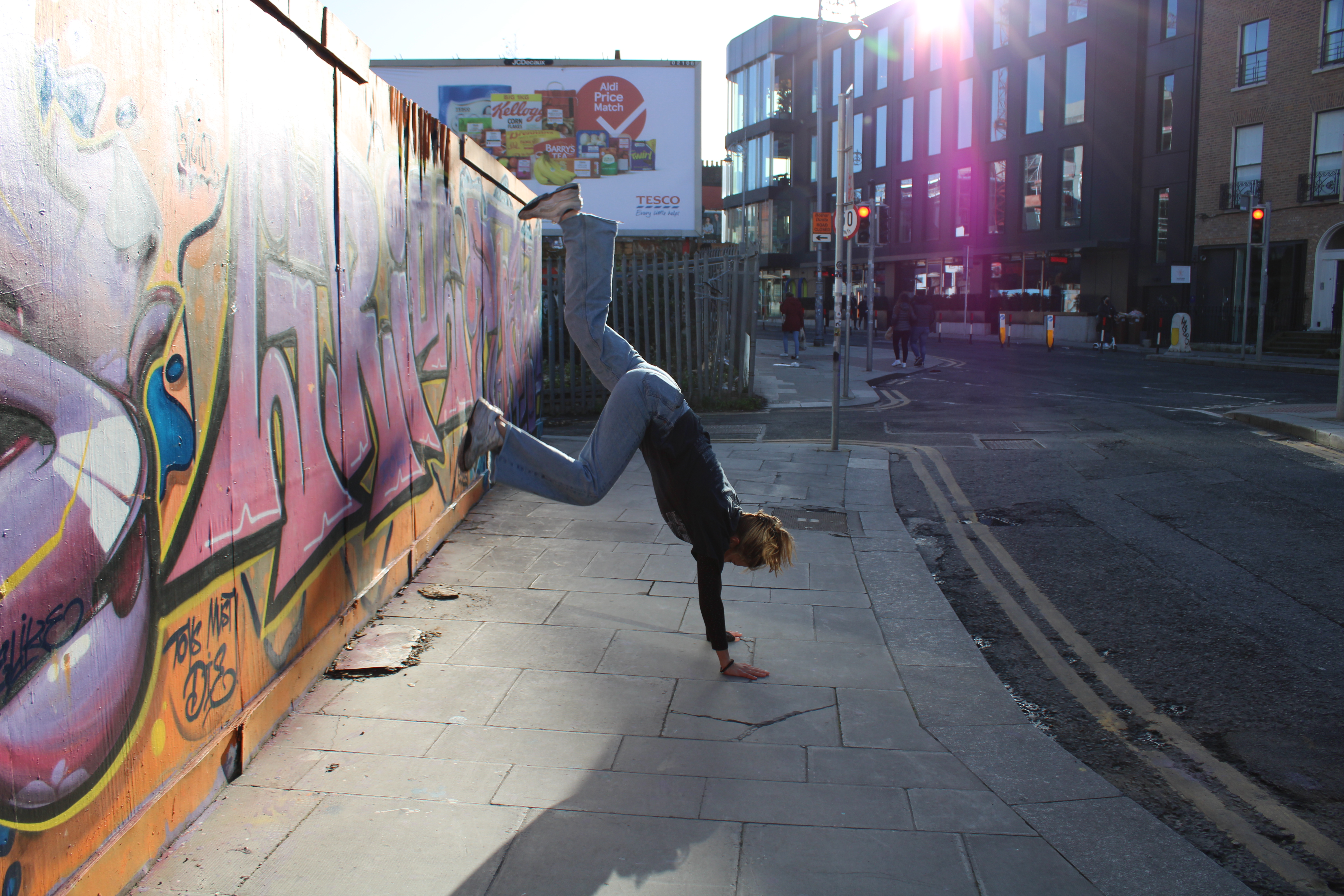 The author trying to do a cartwheel on a pavement.