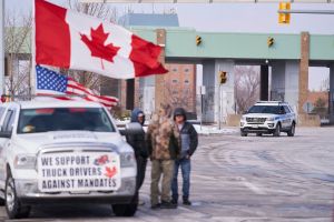 Anti vaccine mandate protestors block the roadway leaving the Ambassador Bridge border crossing, in Windsor, Ontario, Canada on February 8, 2022.