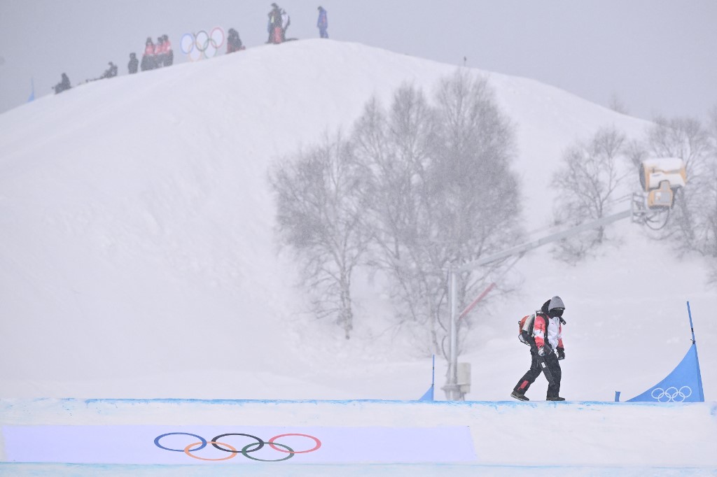 Snow in Beijing delayed Winter Olympics events, as staff cleared the snow at venues.