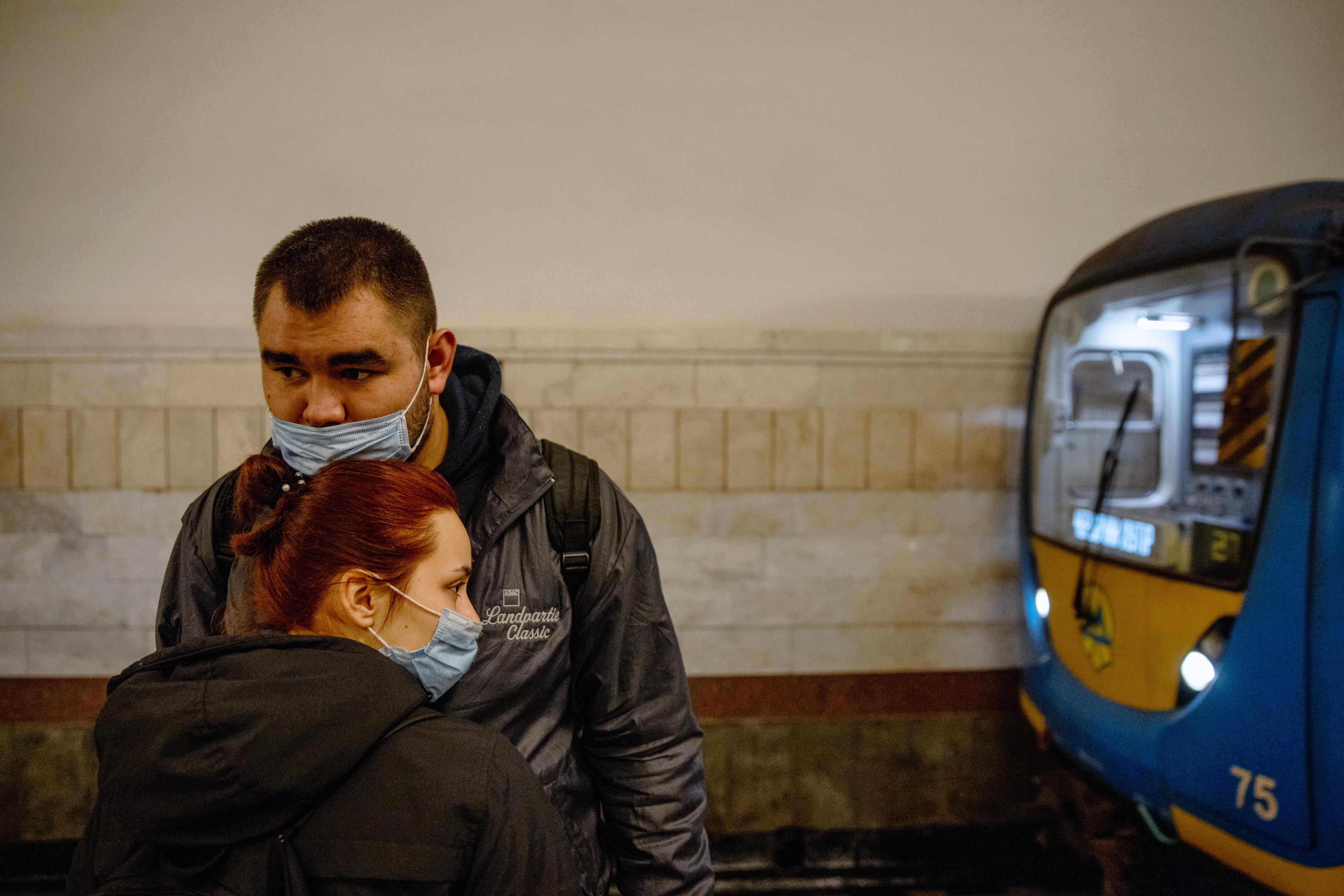 A couple embrace on a platform at a Metro station in Kyiv, Ukraine, on Thursday, Feb. 24, 2022.