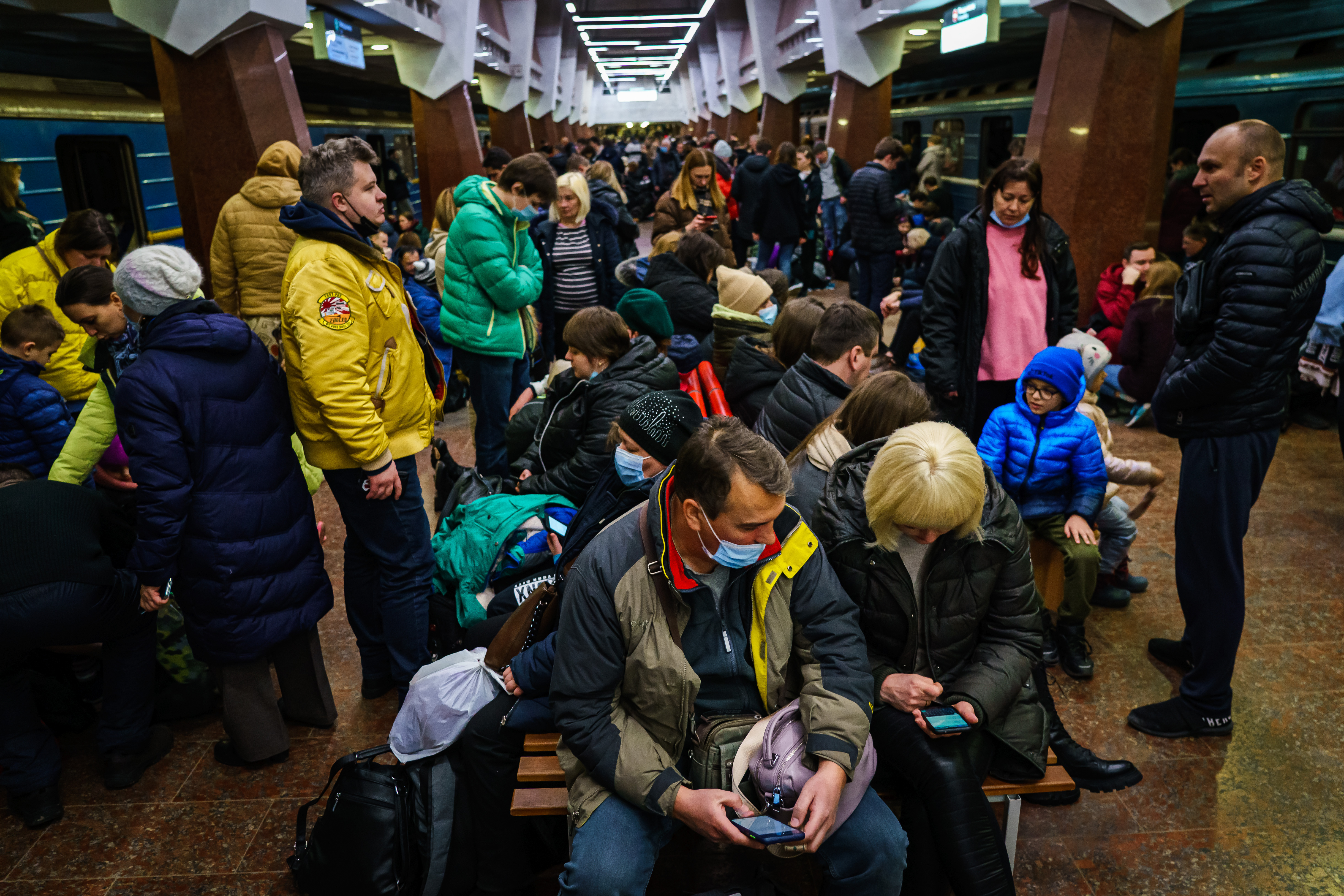 Hundreds of people seek shelter underground, on the platform, inside the dark train cars, and even in the emergency exits, in metro subway station as the Russian invasion of Ukraine continues, in Kharkiv, Ukraine, Thursday, Feb. 24, 2022.