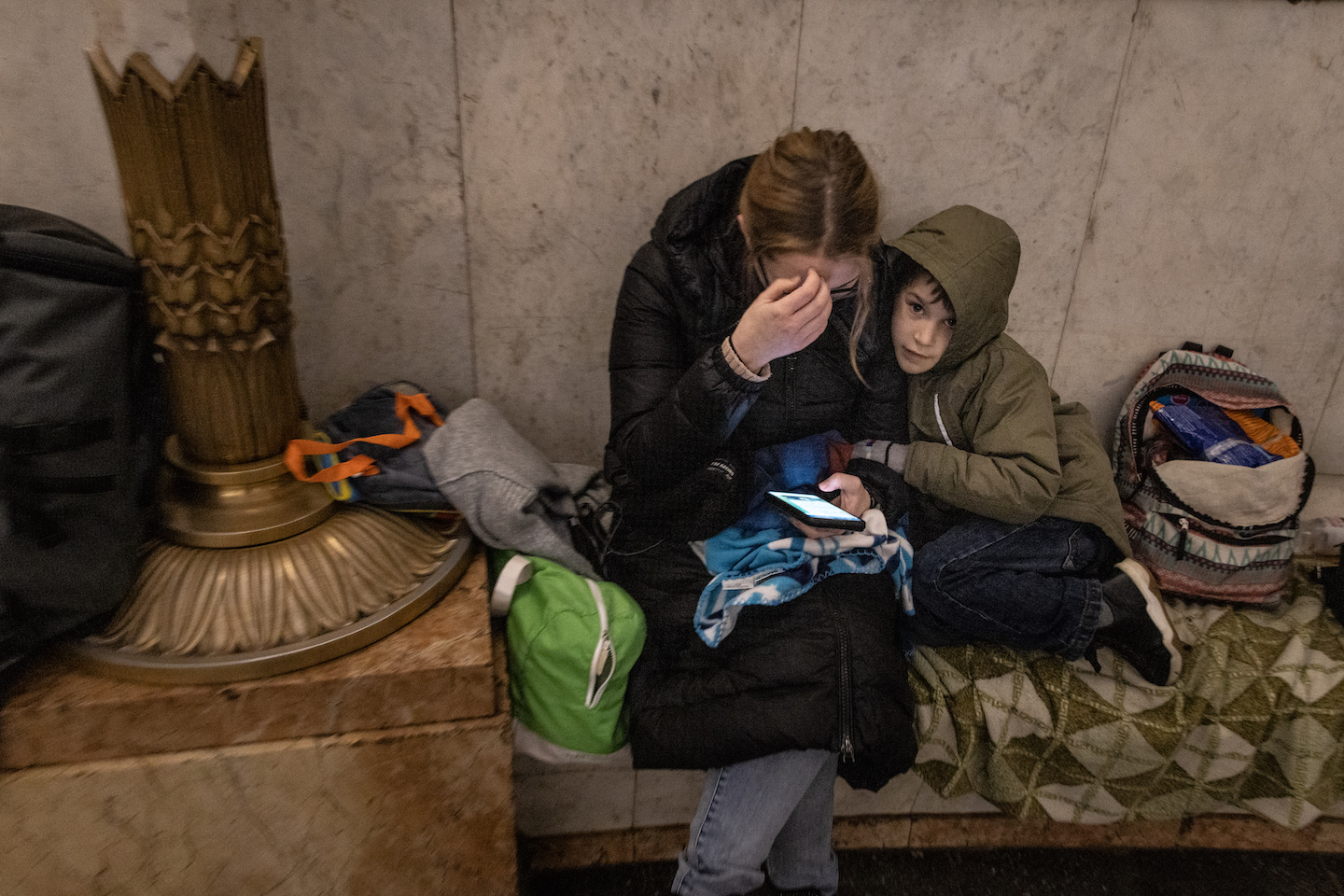 People shelter in a subway station before a curfew comes into effect on February 24, 2022 in Kyiv, Ukraine.