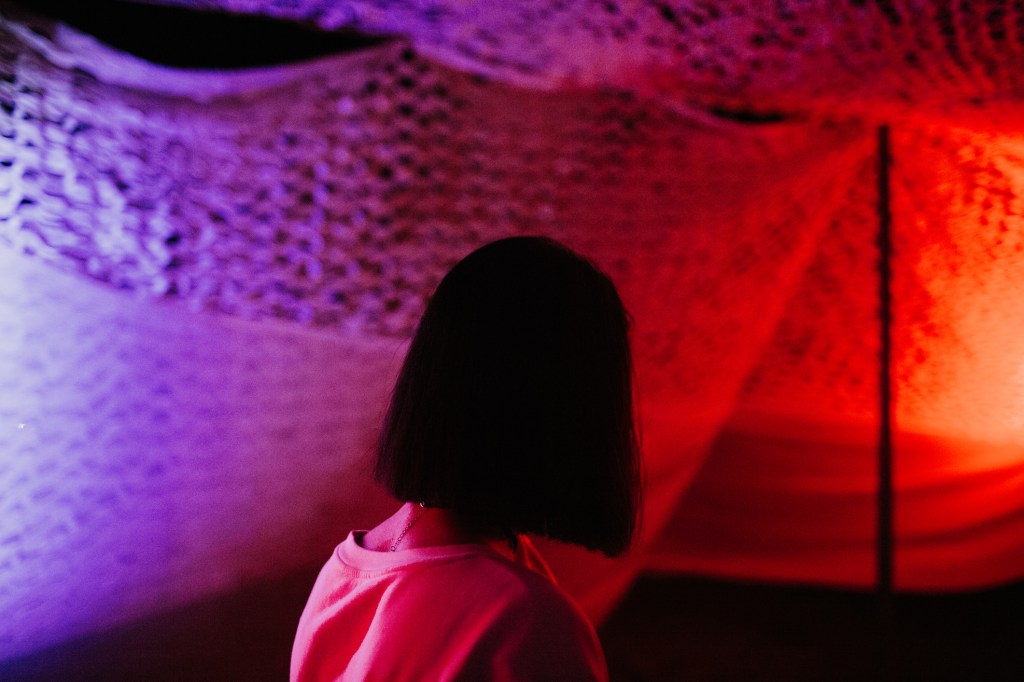 Young girl with a bob haircut turned her side to the camera.