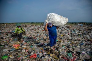 People collect plastic waste in East Java, Indonesia, in 2018.