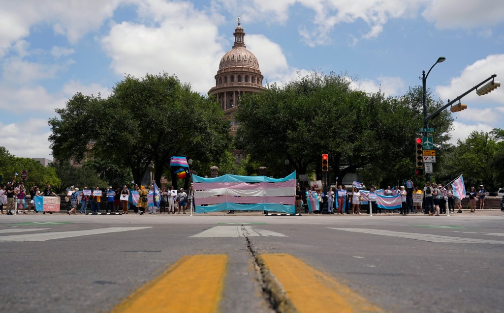 Demonstrators gather on the steps to the State Capitol to speak against transgender related legislation bills being considered in the Texas Senate and House on May 20, 2021, in Austin, Texas.