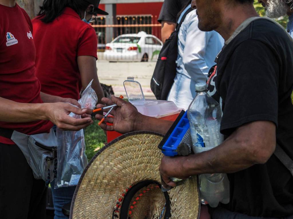 Members of the PrevenCasa harm reduction center give out free needles in Tijuana, but what they really need is nalaxone.