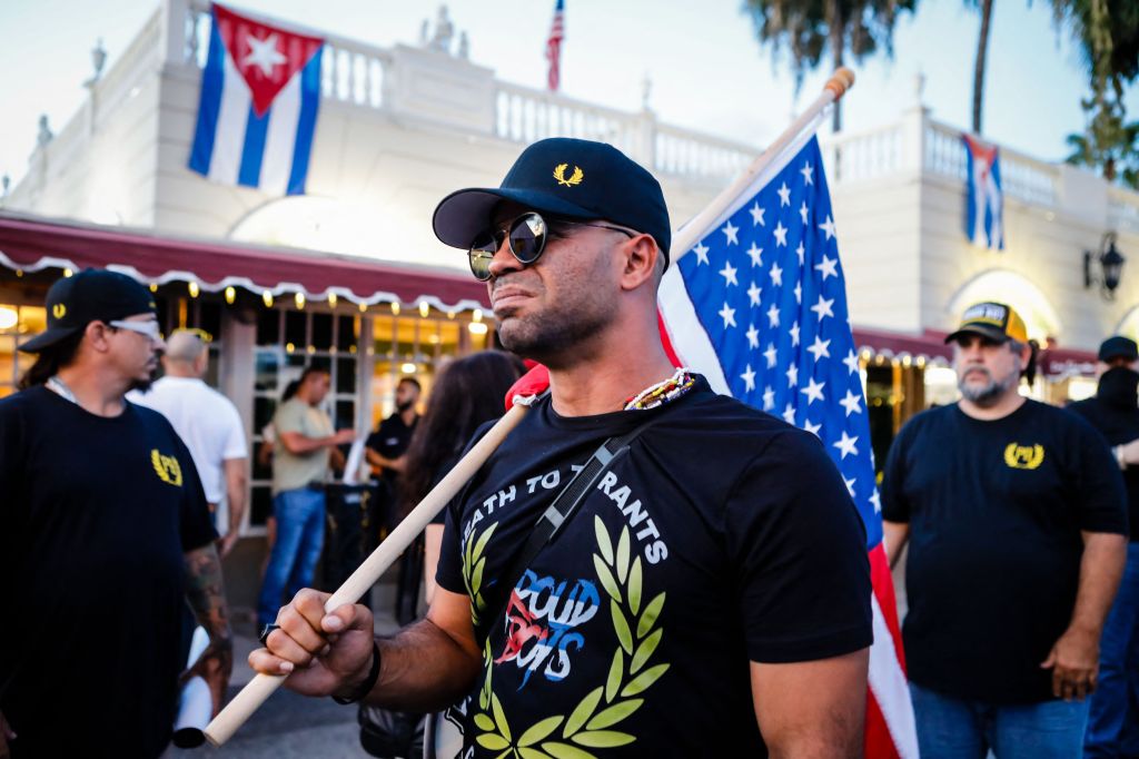 Henry "Enrique" Tarrio, leader of The Proud Boys, holds an US flags during a protest showing support for Cubans demonstrating against their government, in Miami, Florida on July 16, 2021.