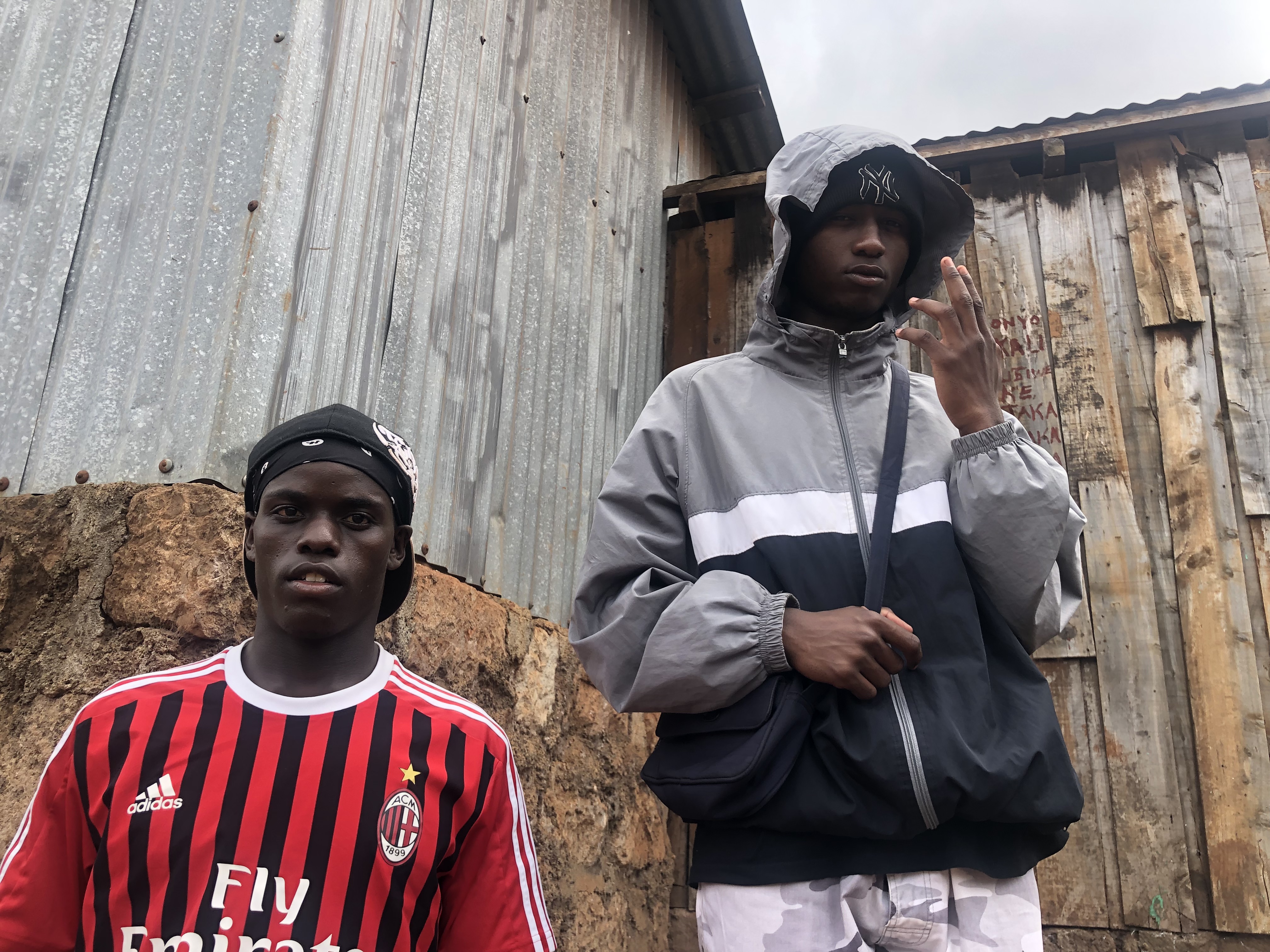 Khedi and Derroh from Kenyan drill group Geri Soweto standing outside