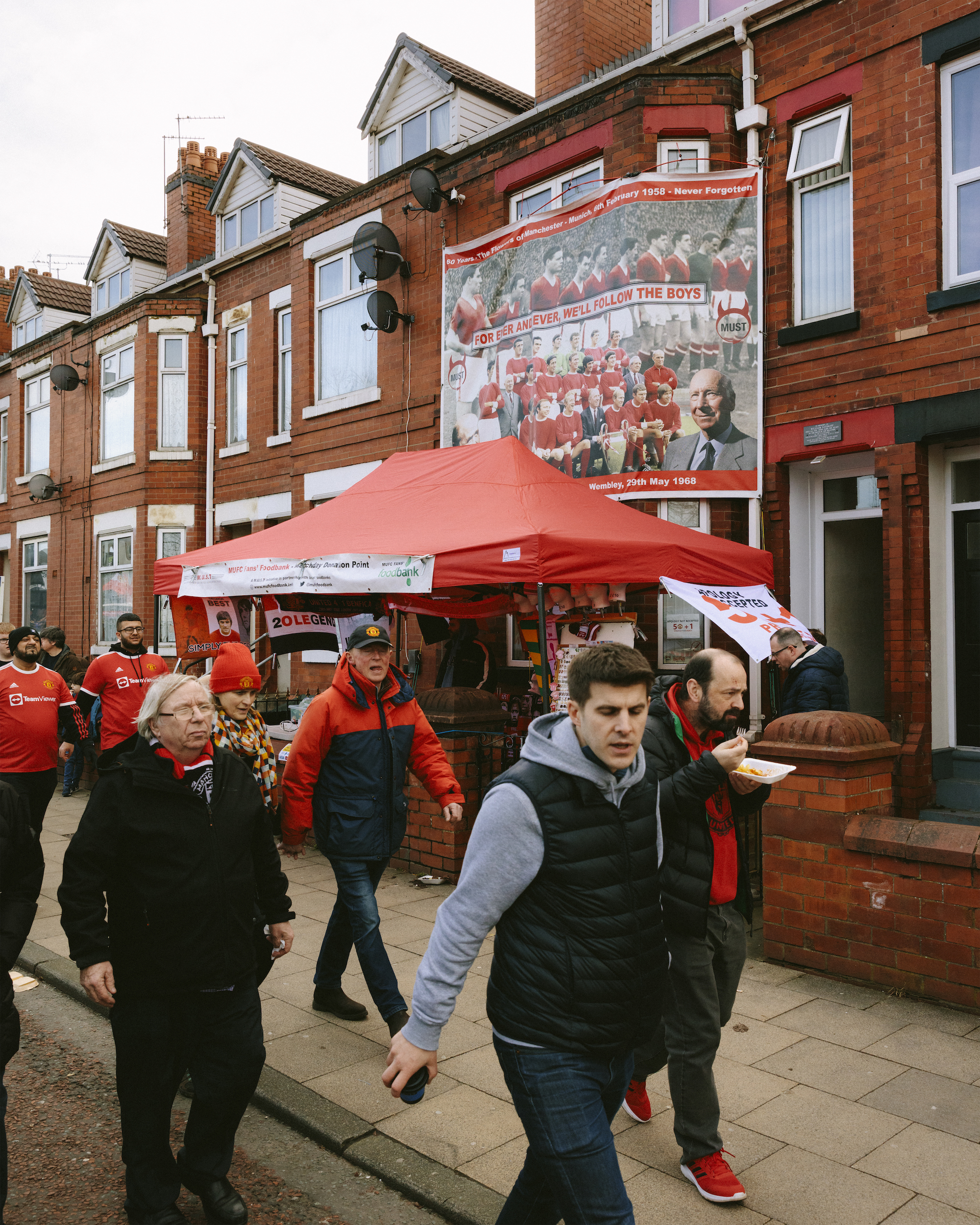 A house displays a banner commemorating the Busby Babes, the Munich air disaster and the 1968 European Cup winners