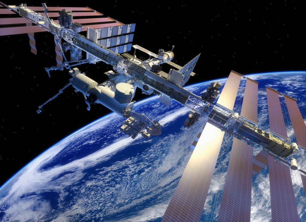 ​Artist's depiction of the International Space Station above Earth. Getty Images