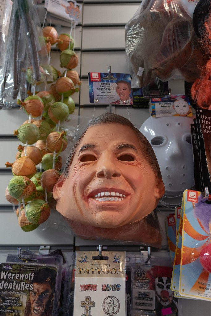 A rubber mask hanging on the wall at Fancy Dress Town. Photo by Aiyush Pachnanda.