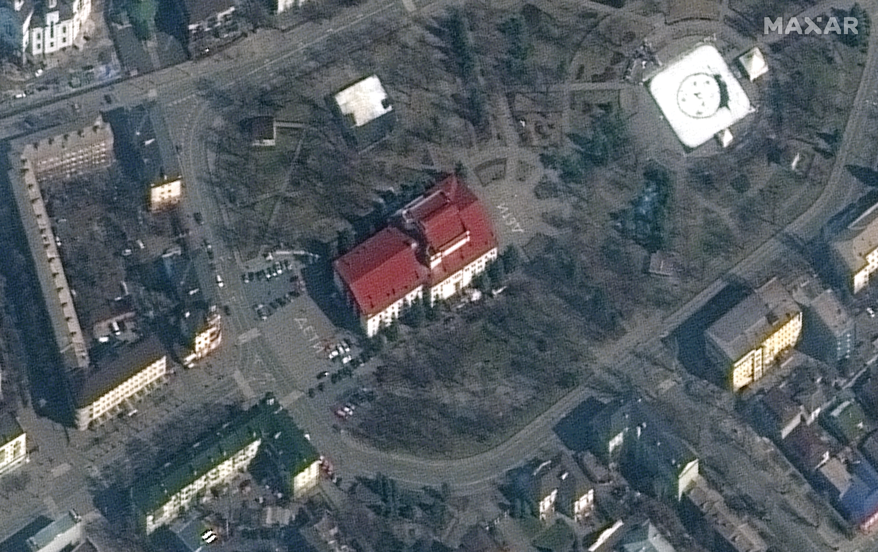 closer view of mariupol theater_before bombing_word_children on pavement_14march2022_wv2.ZABLFf7x.jpg