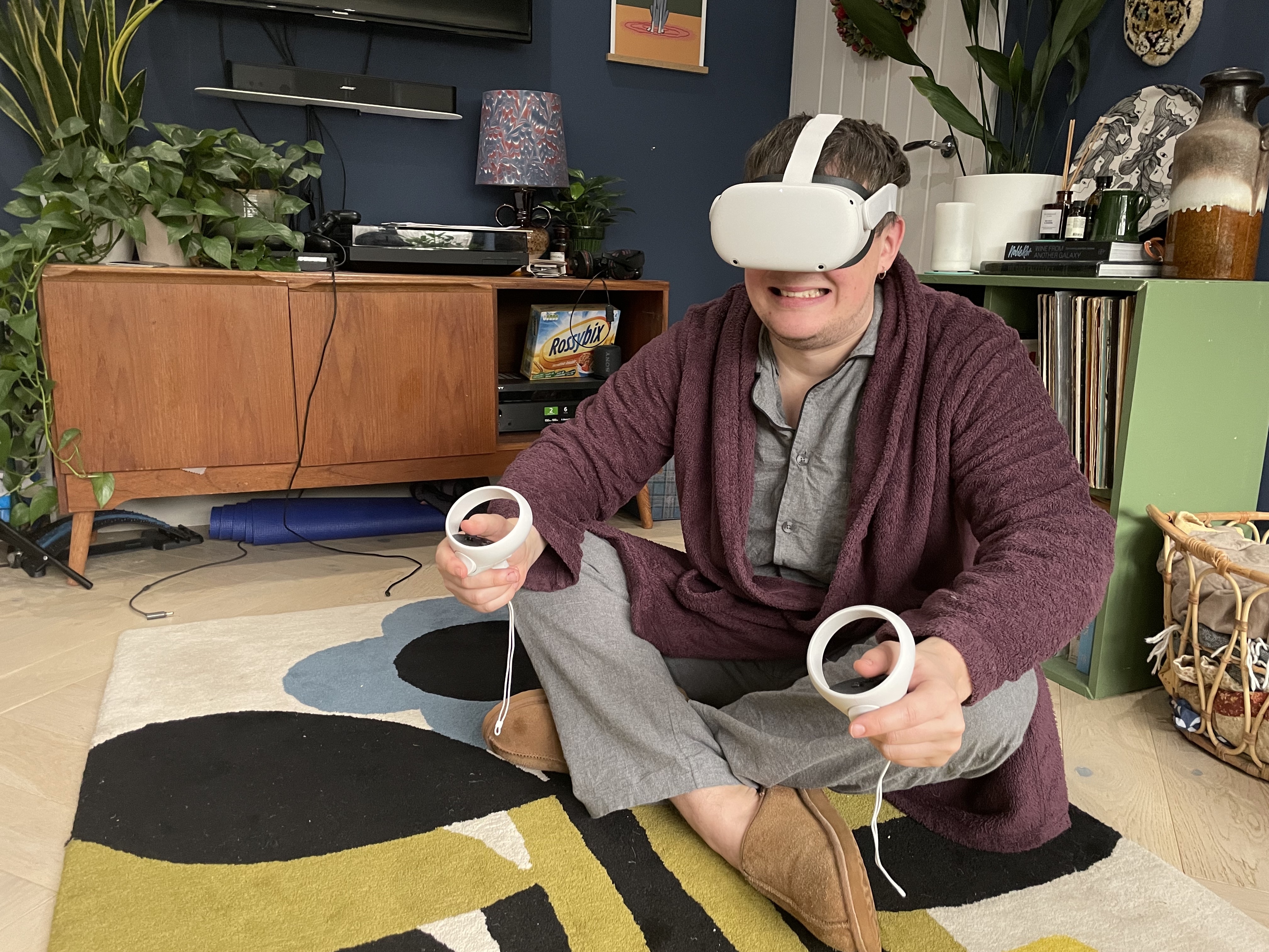 A man in a dressing gown wearing a Meta Quest 2 headset in the metaverse