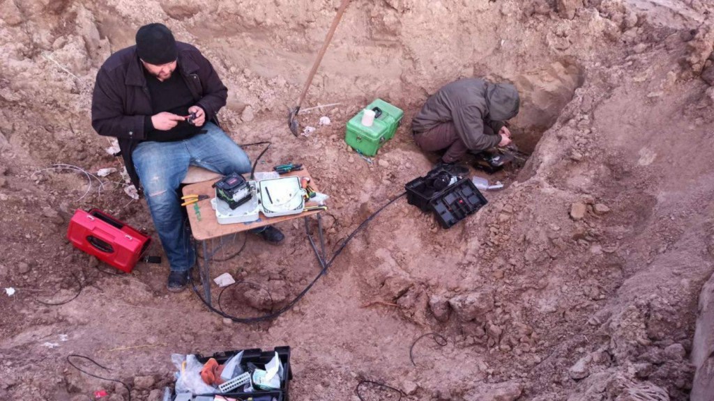 People repairing internet infrastructure