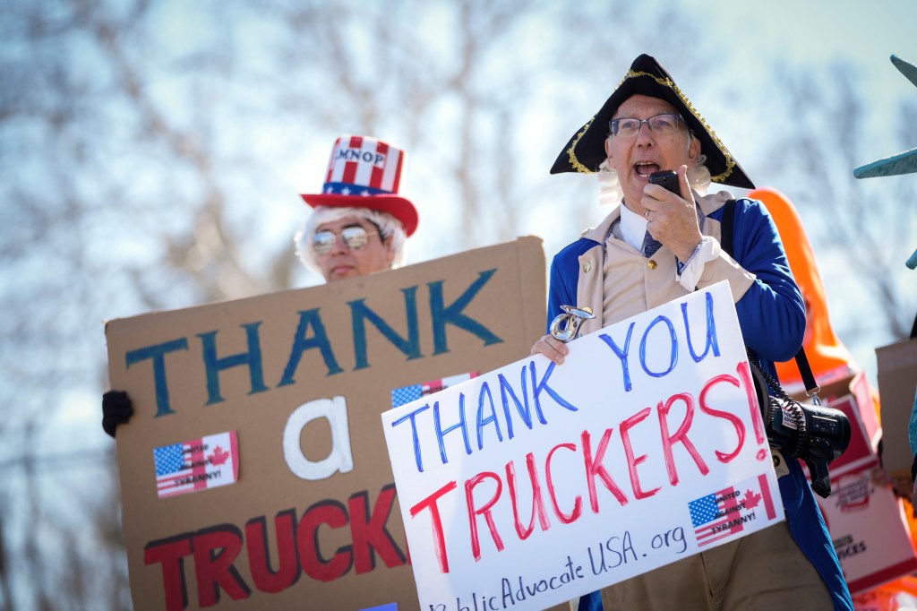 Activists rally at the Hagerstown Speedway as they await the arrival of the Peoples Convoy of truckers on March 4, 2022 in Hagerstown, Maryland.