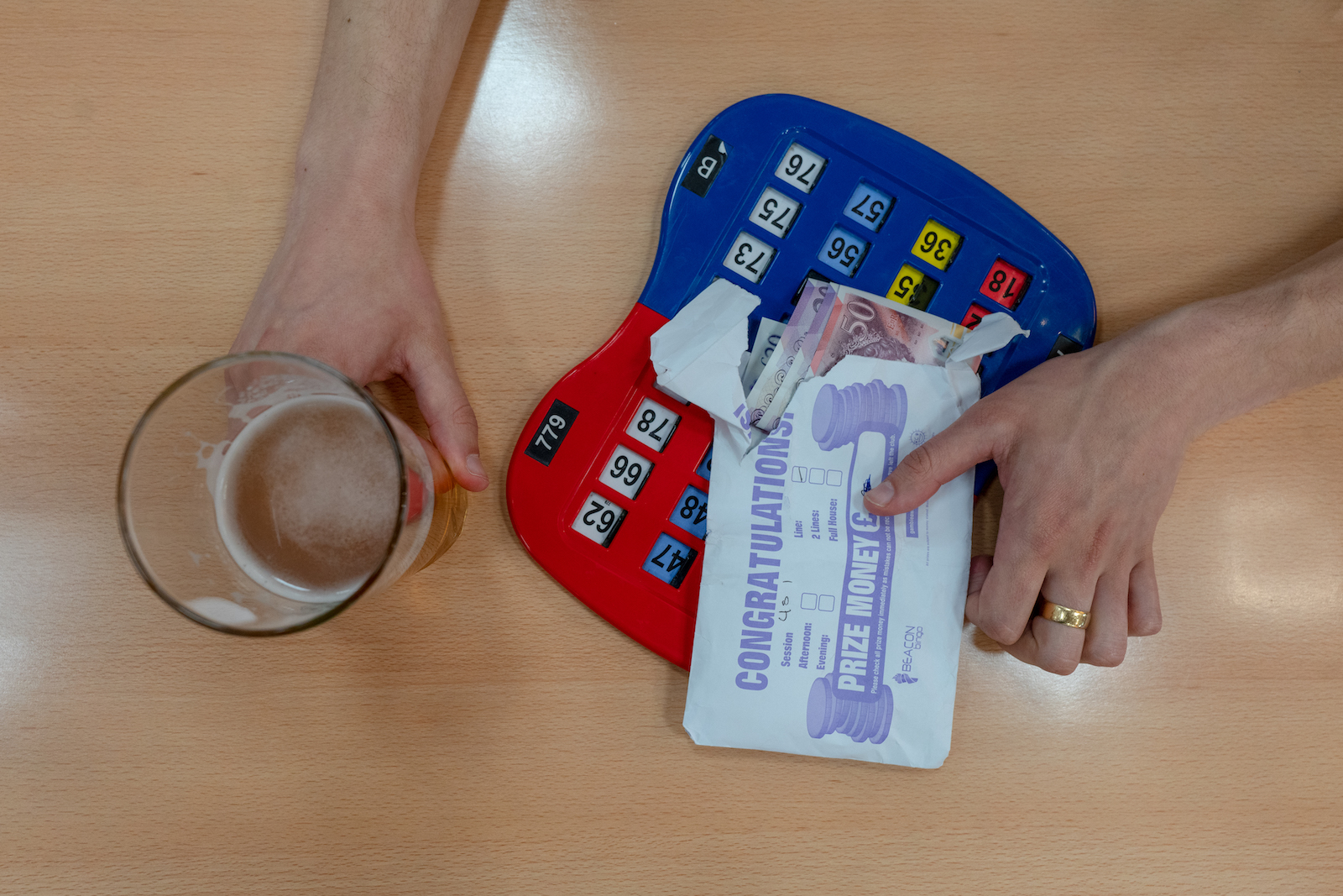 Bingo paraphernalia and a half-drunk pint