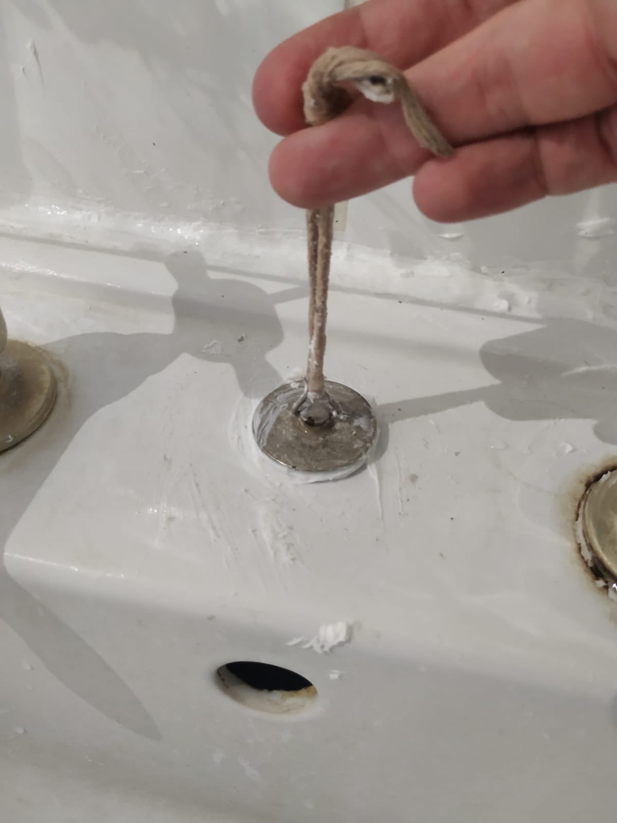 A plug sealed to the top of the sink.