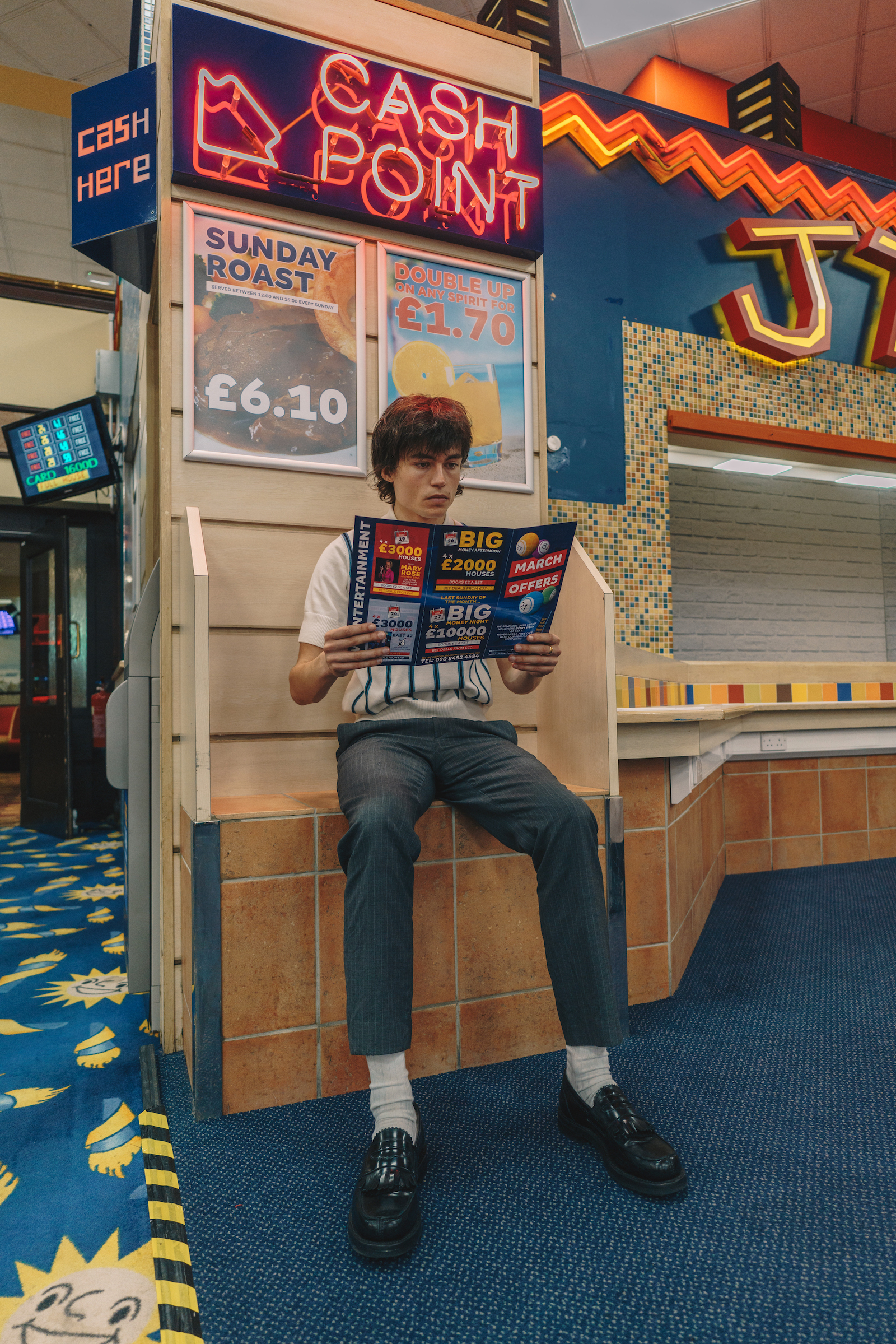 The author flicking through offers at MERKUR Bingo hall