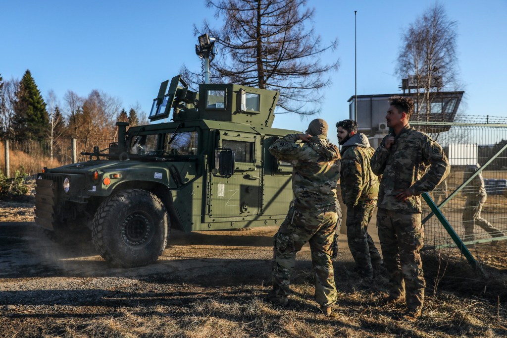 U.S. soldiers of the 82nd Airborne Division and military vehicles are seen at the temporary military base for U.S. troops established at the Arlamow Airport in Poland on February 24, 2022.