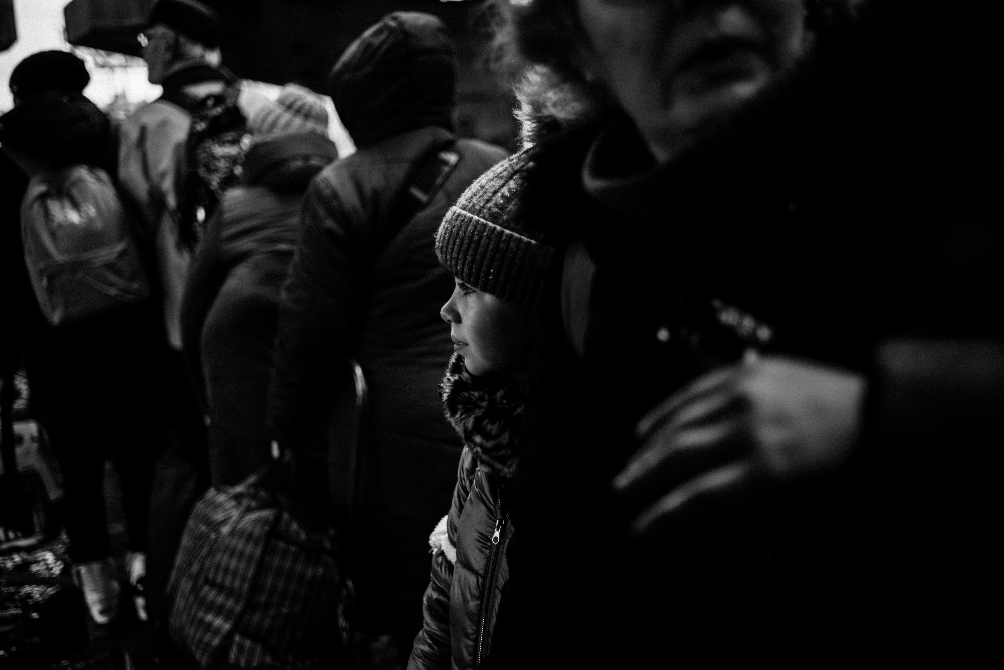 Nastya Voznesenska and her parents walk across the destroyed bridge that connected Irpin and the road to Kyiv. The Voznesenski family (Alla, Dmytro, their children Platon and Nastya) spent 5 days in a basement and left the partly-occupied city on the 9th of March.