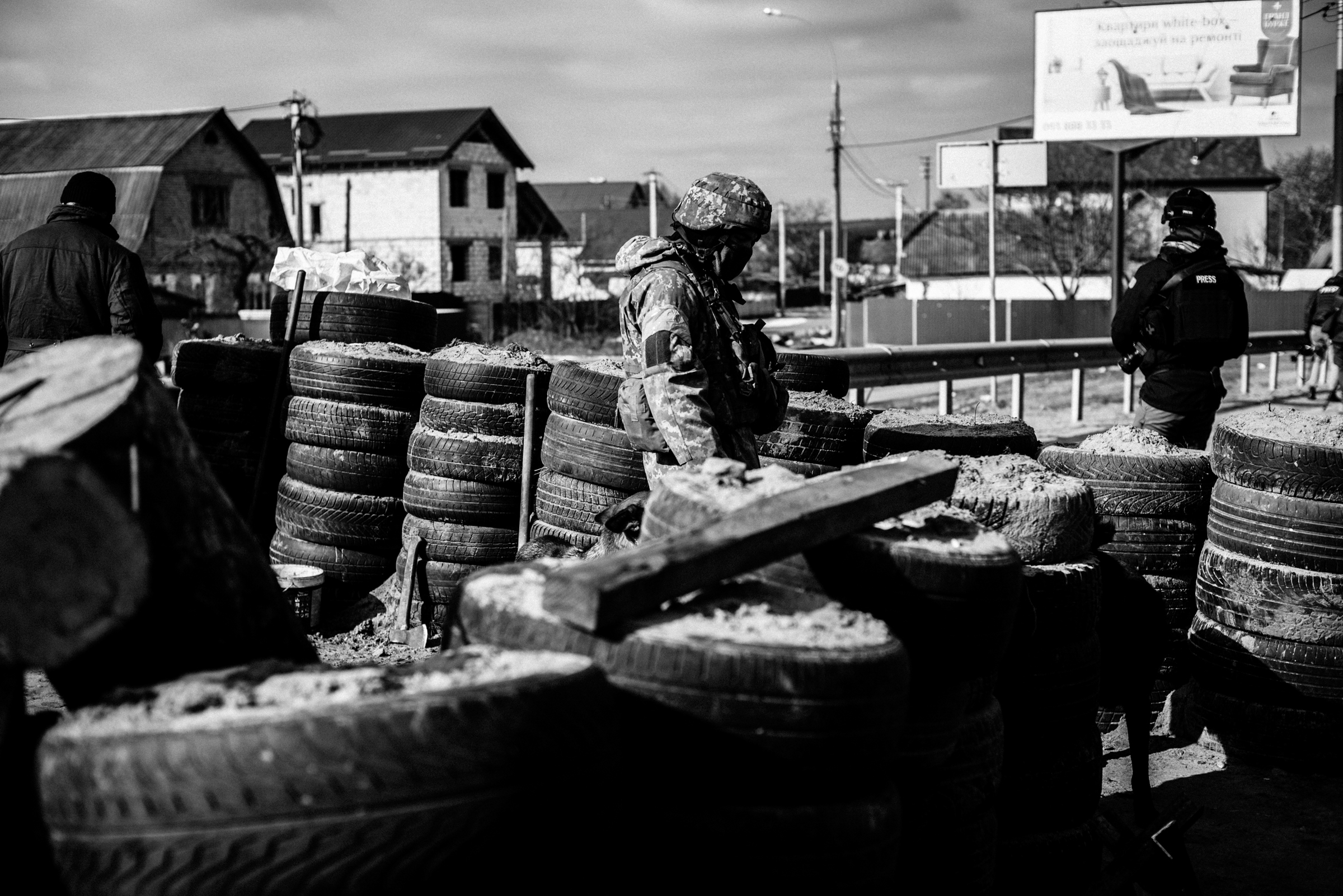 A soldier guards a checkpoint in Kyiv.