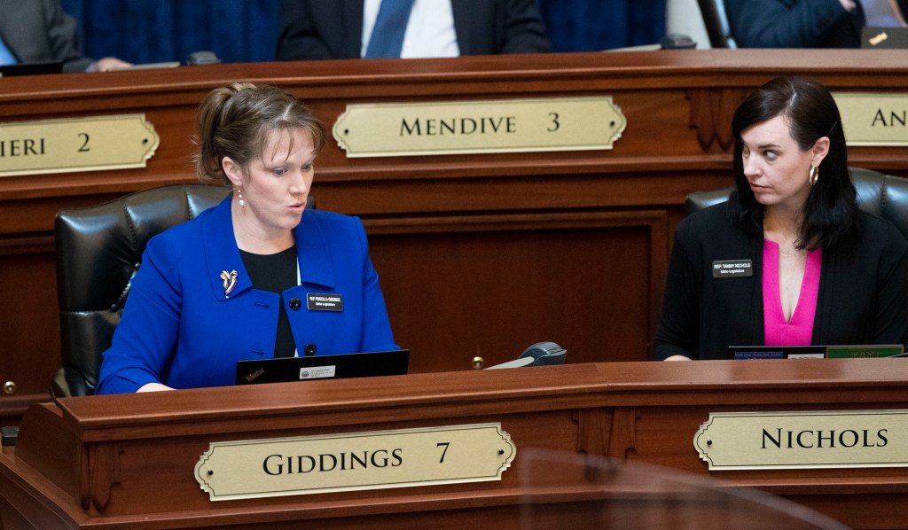 The GOP's Rep. Priscilla Giddings, left, and Rep. Tammy Nichols listen to debate on the floor of the Idaho House of Representatives on April 21, 2021, at the Statehouse in Boise, Idaho.