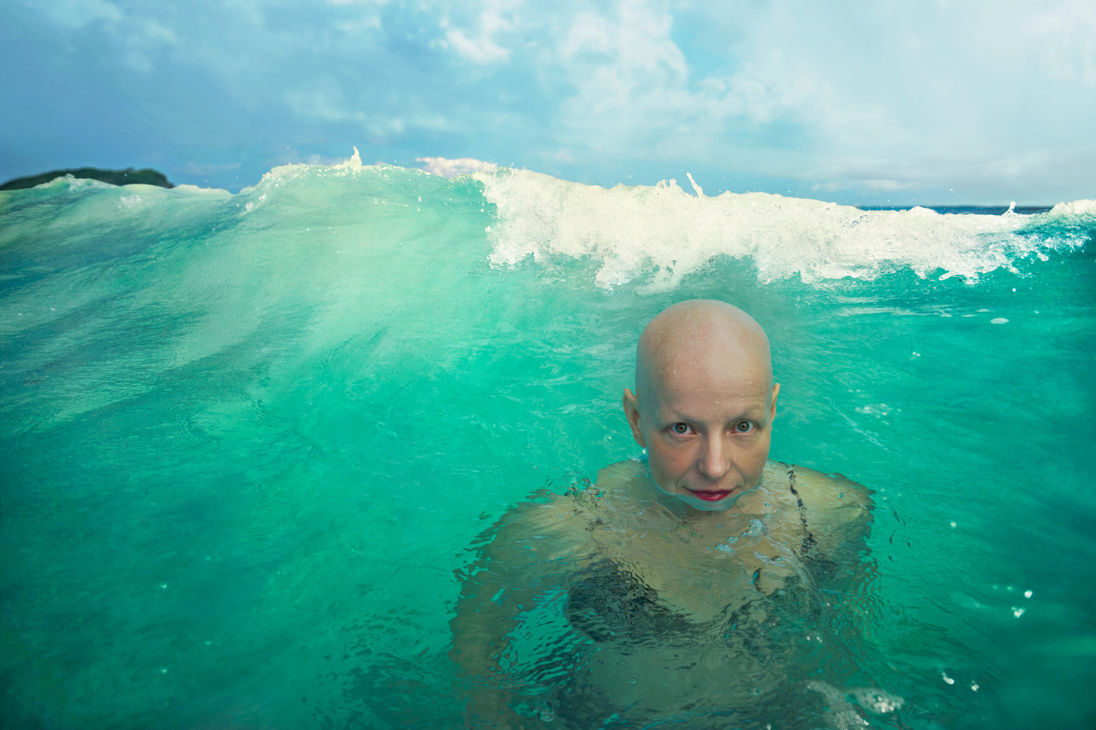 Annie Leibovitz - Rachel Fleit, a Brooklyn-based writer and creative director of Killer Films Media, andproud advocate for women with Alopecia, takes a dip in the ocean.jpg