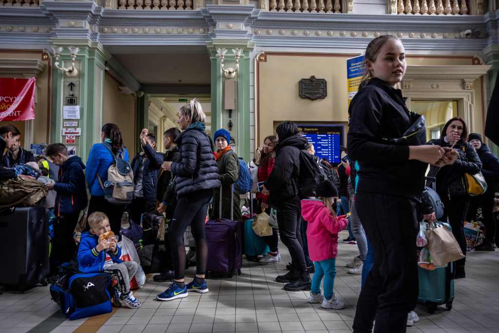 Refugees from Ukraine wait in the ticket hall of the railwlay station in Przemysl, eastern Poland, which has become a hub for refugees from Ukraine fleeing their country due to Russia's aggression.​ But today, many Ukrainians are also opting to go back ho