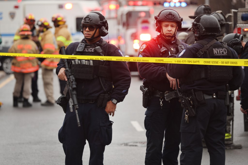 Police and emergency responders gather at the site of a reported shooting of multiple people outside of the 36 St subway station on April 12, 2022 in the Brooklyn borough of New York City.