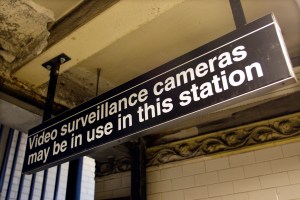 Video surveillance cameras may be in use in this station sign