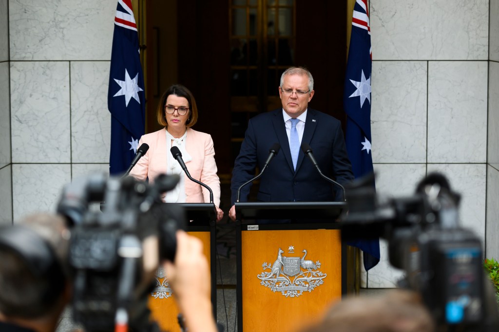 Anne Ruston and Scott Morrison appear before reporters in Canberra.