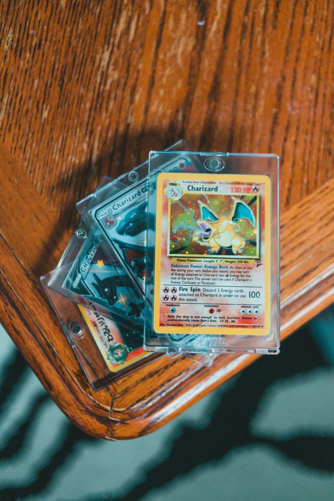 Pokemon cards on a table. Photo by Erik Mclean on Pexels