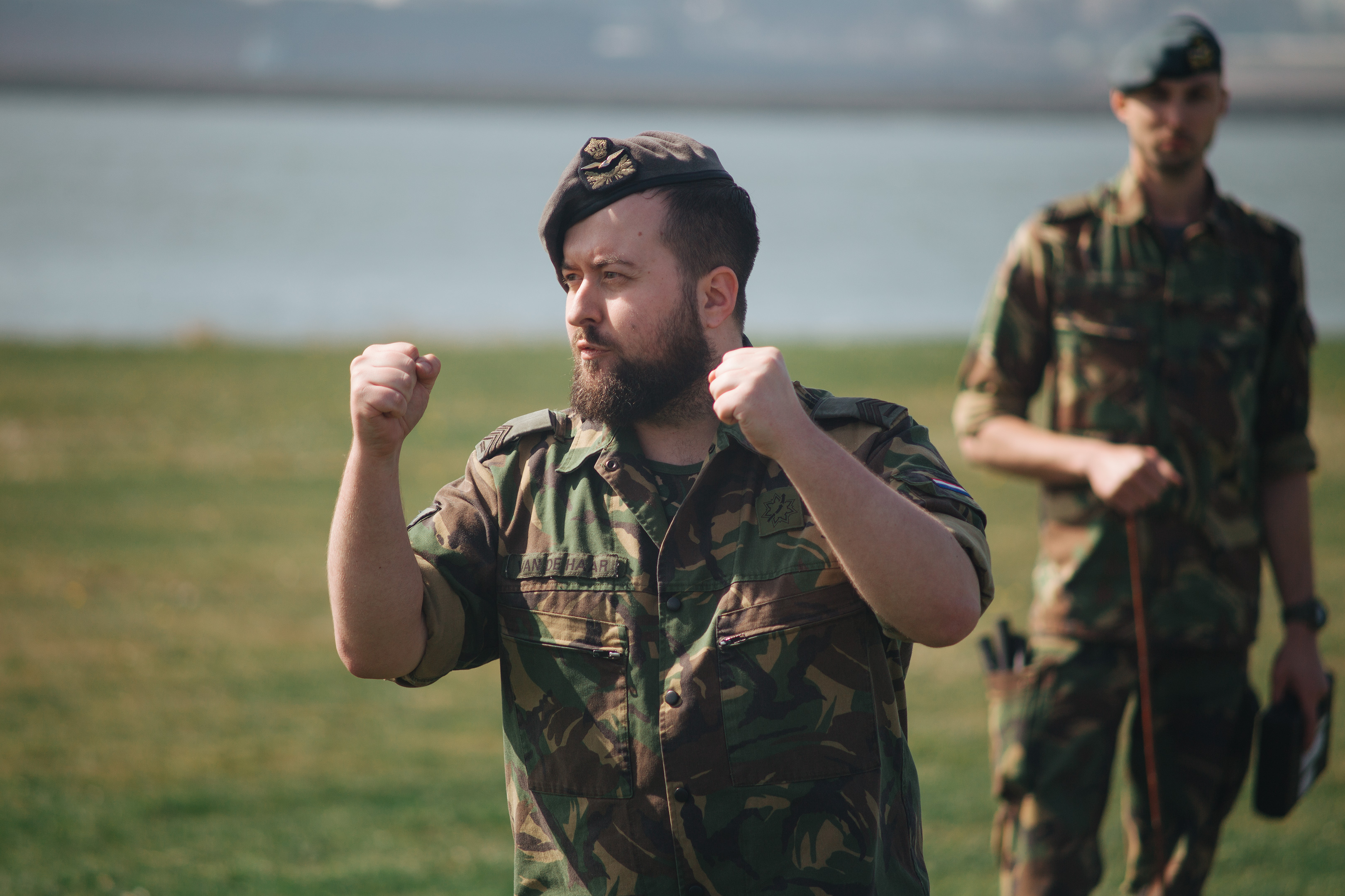 Army recruitment, Fort 1881 – A man in military uniform with a full beard, holding his fists up while speaking.