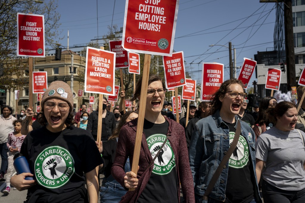 Demonstrators during the 'Fight Starbucks Union Busting' rally in Seattle, Washington, U.S., on Saturday, April 23, 2022. (David Ryder/Bloomberg via Getty Images)