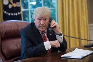 President Donald Trump on the phone at the White House