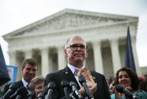 Plaintiff Jim Obergefell holds a photo of his late husband John Arthur as he speaks to members of the media after the U.S. Supreme Court handed down a ruling regarding same-sex marriage June 26, 2015 outside the Supreme Court in W