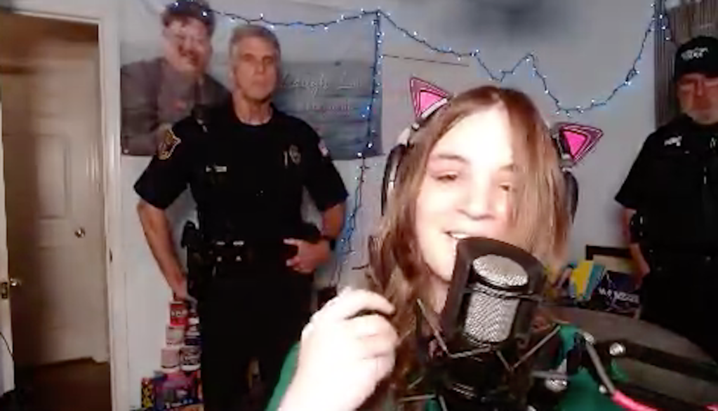 Screenshot of Wynn on Twitch with two police officers standing behind her.