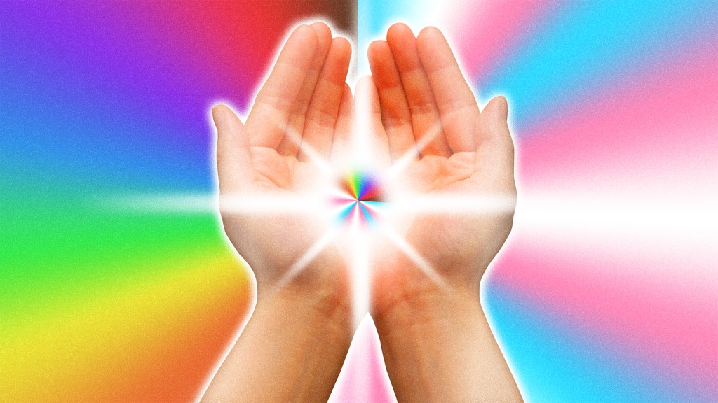 Hands holding rainbow light with trans and LGBTQ pride colors in background