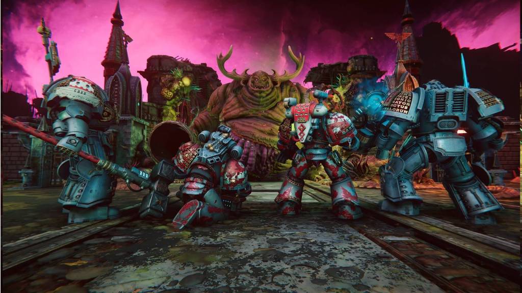 Screenshot from Chaos Gate: Daemon Hunters, four space marines stand facing a large tree like monster, while the sky glows in a purple pink light.